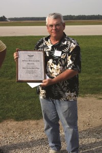Mike receiving his AMA Model Aviation Hall of Fame plaque in 2008. Photo by Stan Alexander.