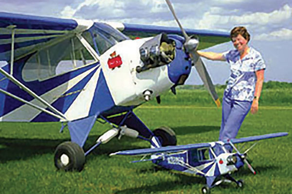 Hazel with both her full-scale and model clipped-wing Cubs.