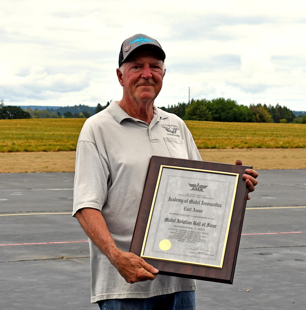 Earl Aune was all smiles while receiving his plaque.