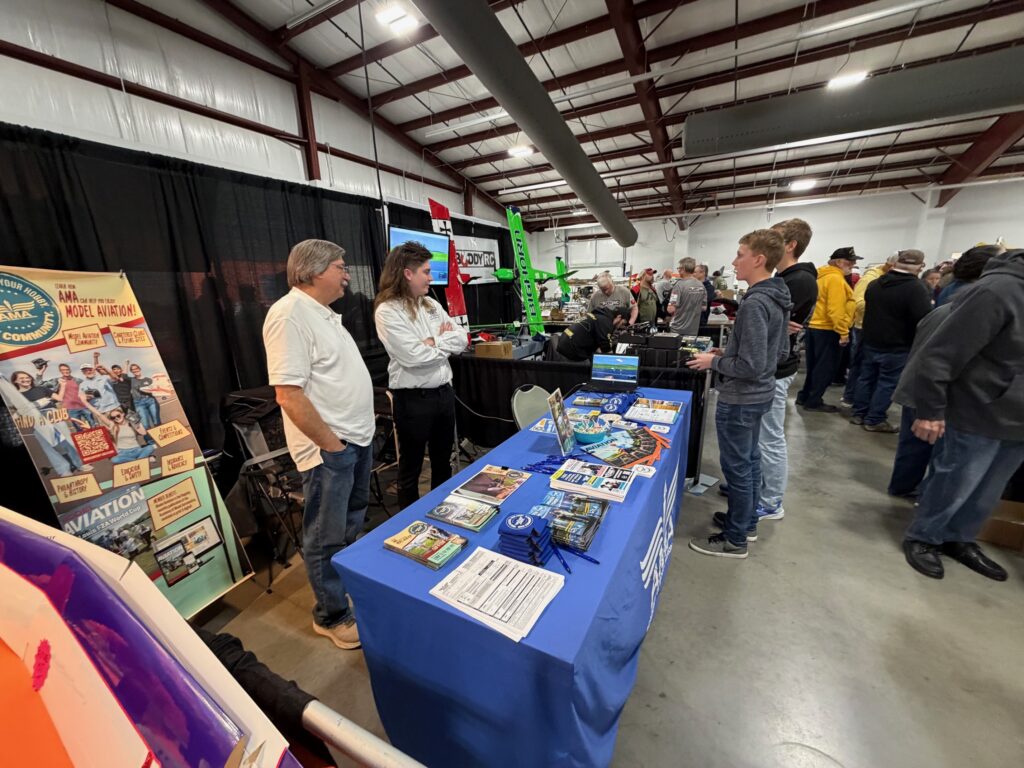 Some youth trying out the District III flight simulator.