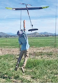 Aurelius Lin launches his airplane at the NYAA Cup contest that was held at Taibi Field in Perris, Calif. 
